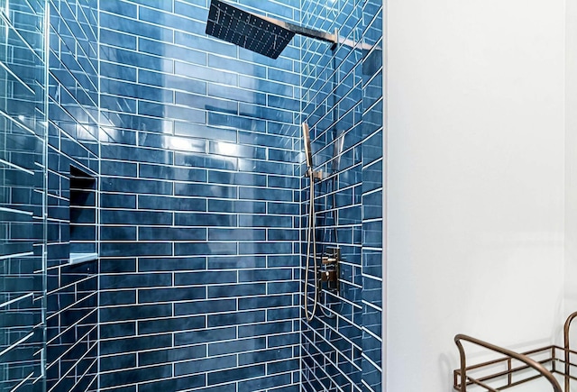 bathroom with a tile shower