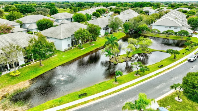 aerial view featuring a residential view and a water view