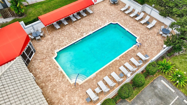 view of swimming pool with fence