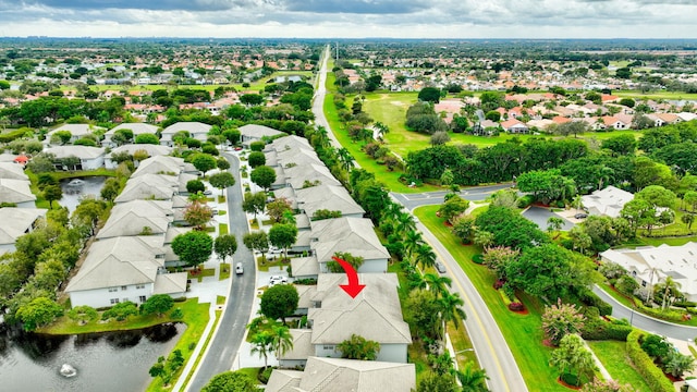 aerial view with a residential view and a water view