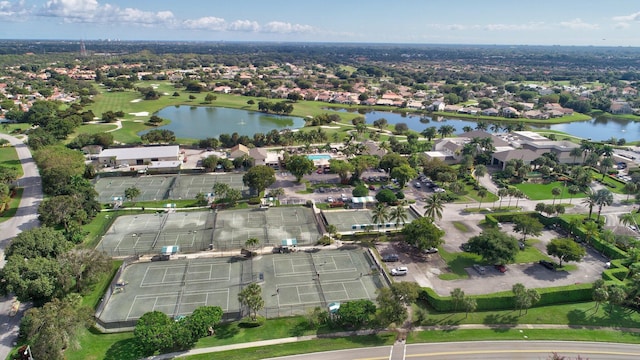 bird's eye view featuring view of golf course, a water view, and a residential view