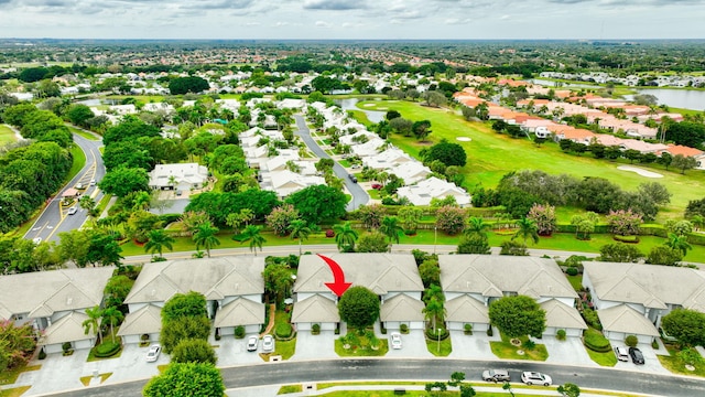 aerial view with a residential view and view of golf course