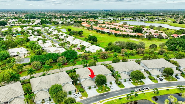 birds eye view of property with a residential view, golf course view, and a water view