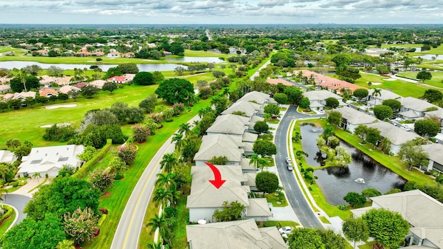 bird's eye view with a water view and a residential view