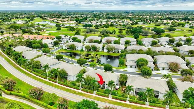 birds eye view of property with a residential view and a water view