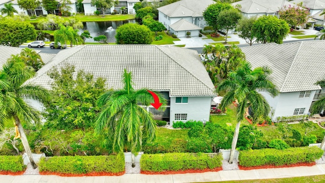 drone / aerial view with a residential view and a water view