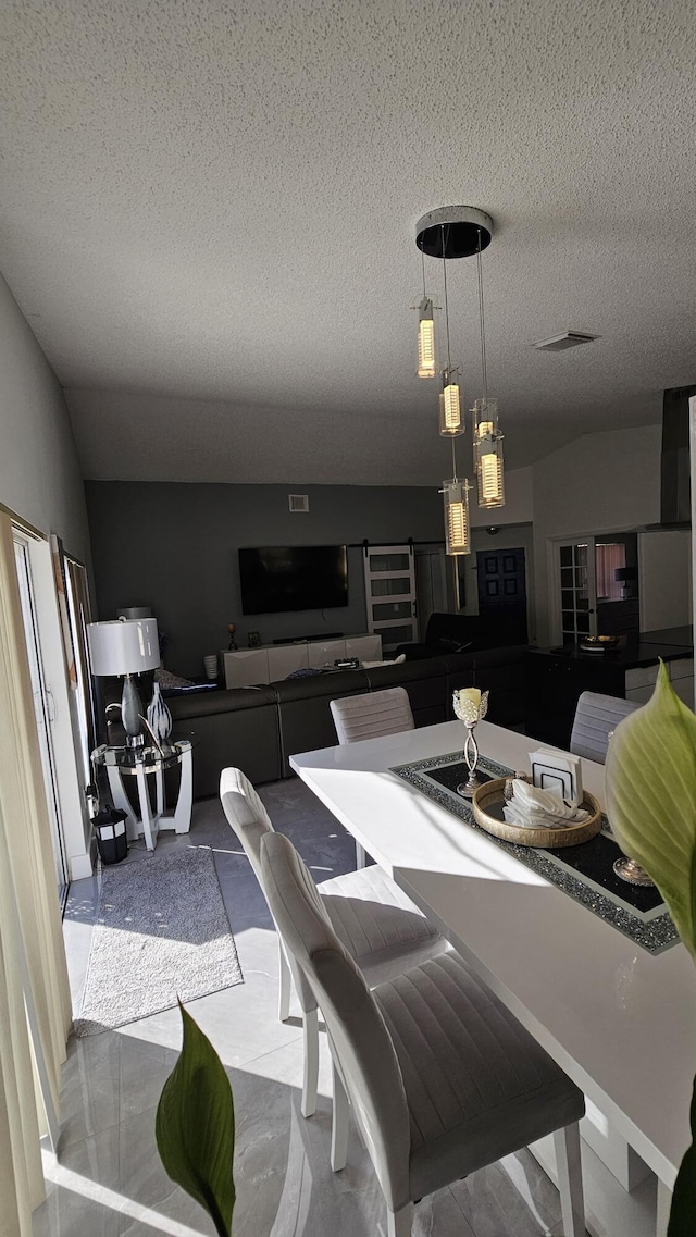 dining space featuring a textured ceiling