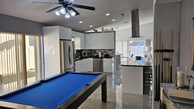 game room featuring lofted ceiling, a textured ceiling, ceiling fan, and billiards