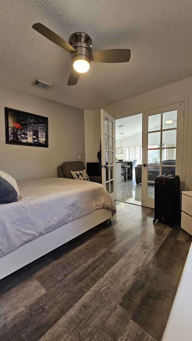 bedroom featuring a textured ceiling, french doors, and ceiling fan