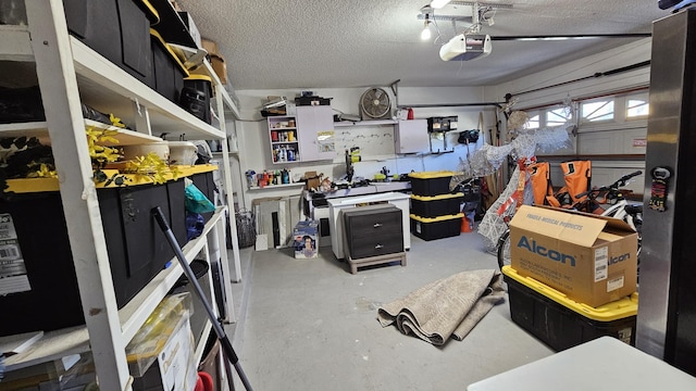 garage with a workshop area and a garage door opener