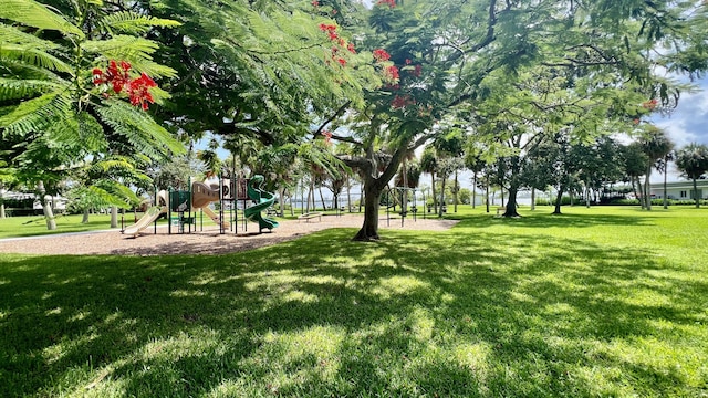 exterior space with a playground and a yard