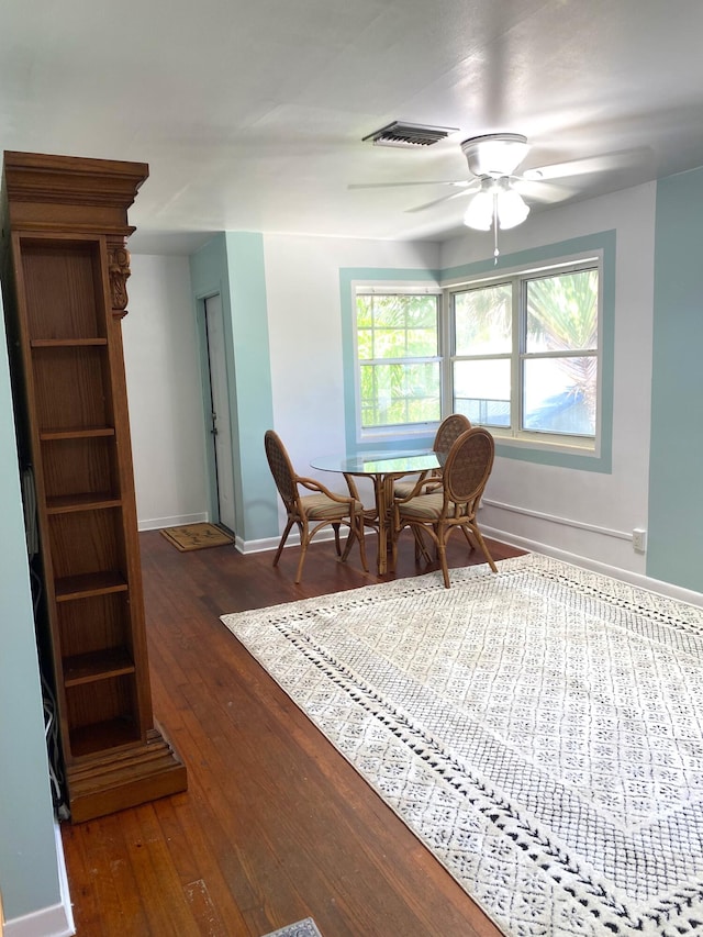 sitting room featuring ceiling fan and dark hardwood / wood-style flooring