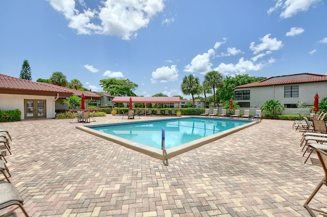 view of swimming pool featuring a patio area