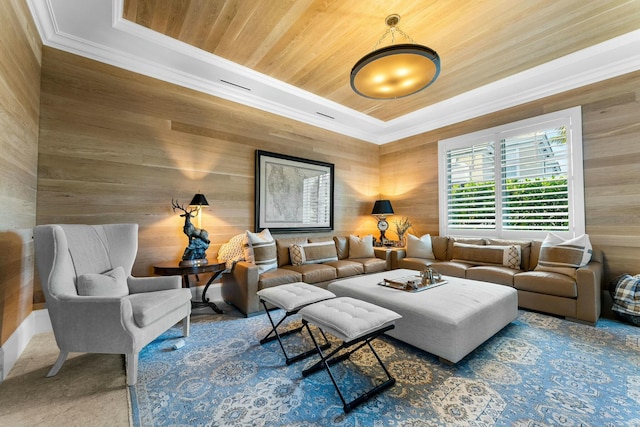 living room with wooden walls, ornamental molding, and wood ceiling