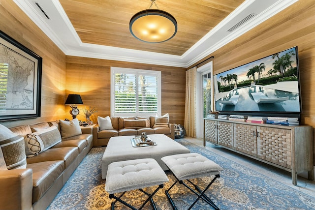 dining space featuring a chandelier, a tray ceiling, light hardwood / wood-style floors, and a wealth of natural light