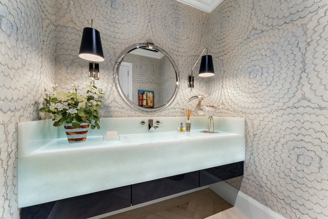 bathroom featuring crown molding and vanity