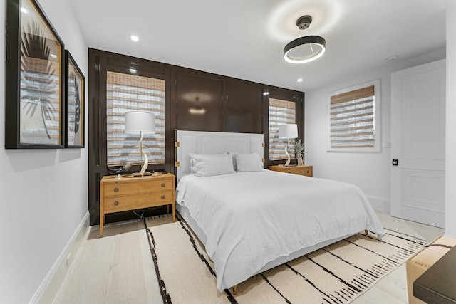 bedroom with light hardwood / wood-style floors