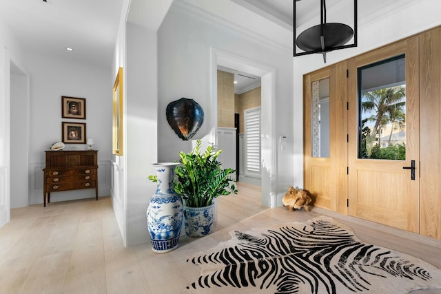 living room with beamed ceiling and light hardwood / wood-style flooring