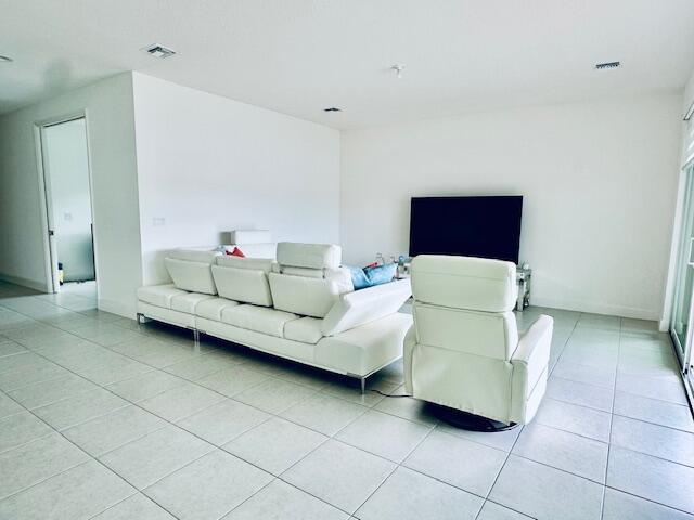 living room with light tile patterned floors