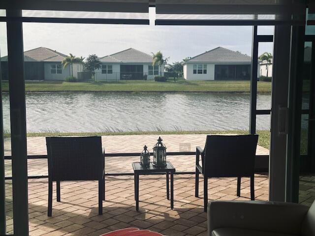 dock area featuring a patio area and a water view