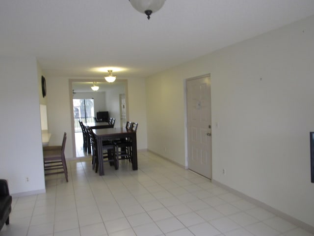 dining area with light tile patterned floors