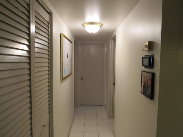 corridor with light tile patterned floors