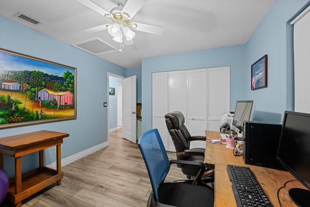 office area with ceiling fan and light hardwood / wood-style floors