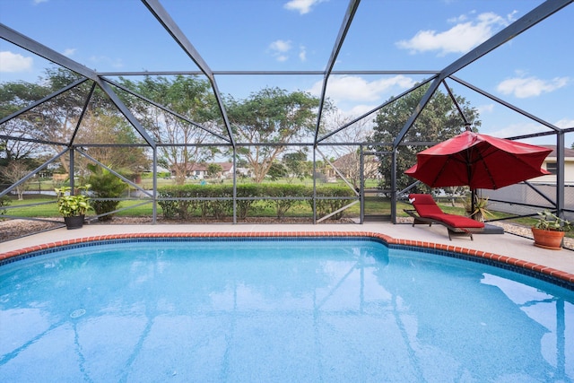 view of pool featuring a lanai and a patio