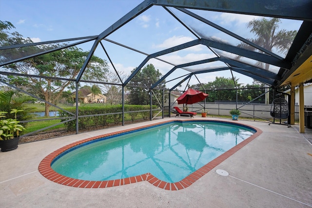 view of pool with a lanai and a patio