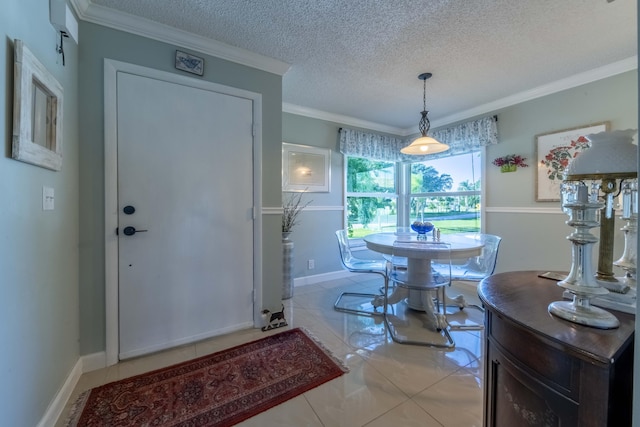 dining space featuring a textured ceiling, light tile patterned floors, and crown molding