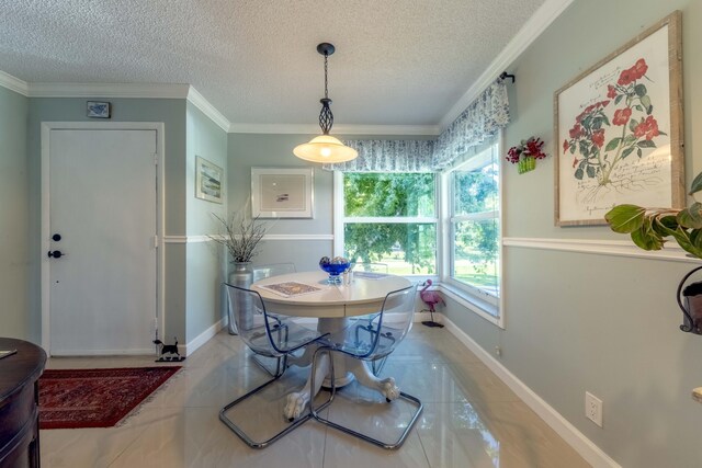 dining space featuring light tile patterned flooring, crown molding, and a textured ceiling