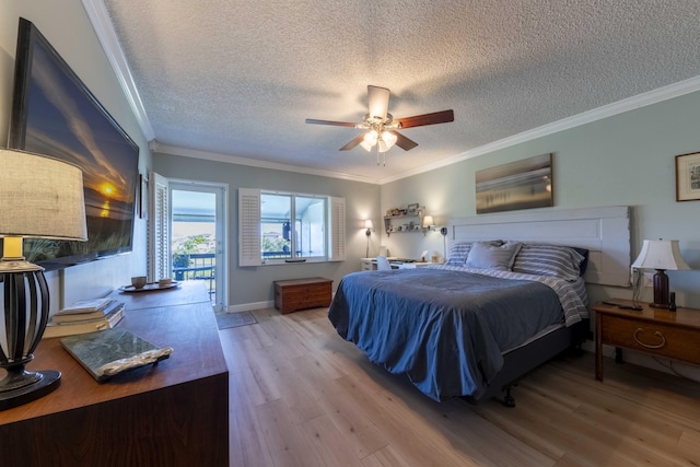 bedroom featuring ceiling fan, wood-type flooring, crown molding, and a textured ceiling