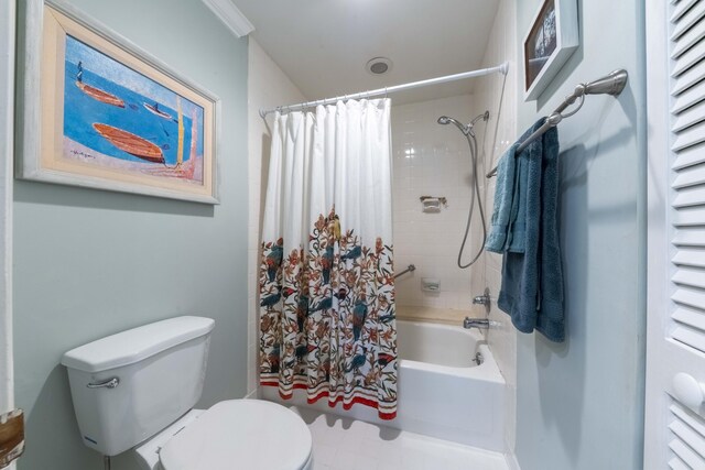 bathroom with toilet, crown molding, and shower / bath combination with curtain