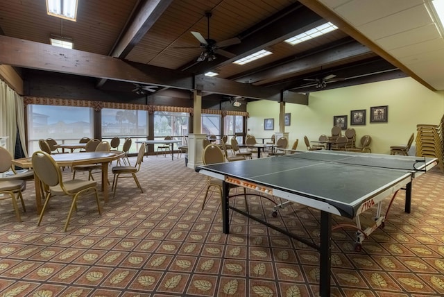 game room featuring ceiling fan, wood ceiling, and beamed ceiling