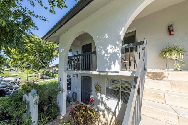 rear view of property featuring a balcony