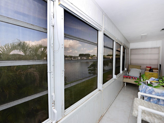 sunroom with a water view