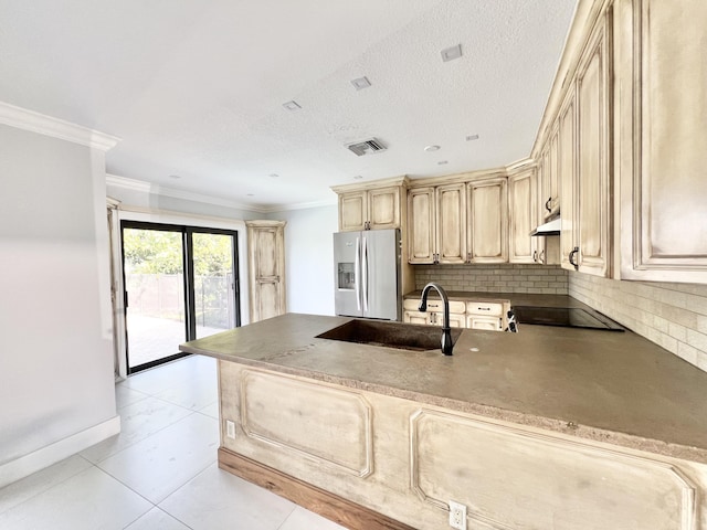 kitchen with sink, crown molding, stainless steel fridge with ice dispenser, kitchen peninsula, and decorative backsplash