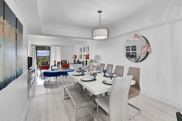 dining space with light wood-type flooring