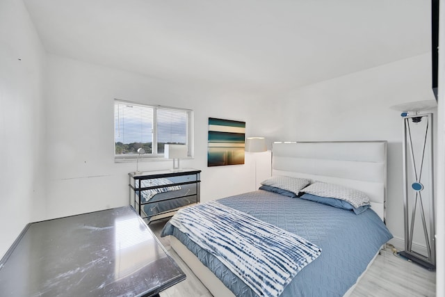 bedroom with light hardwood / wood-style flooring