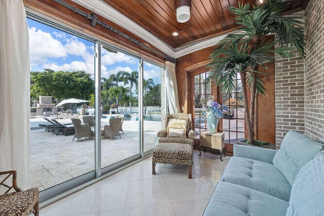 sunroom / solarium featuring wood ceiling