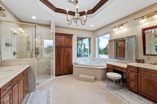 bathroom featuring a tray ceiling, ornamental molding, and independent shower and bath