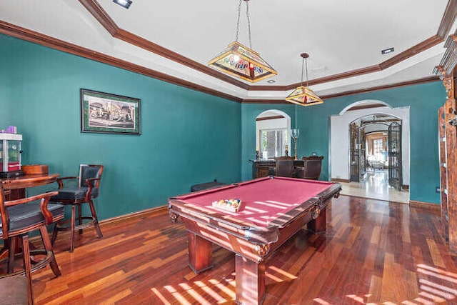 recreation room with dark wood-type flooring, billiards, crown molding, and a raised ceiling