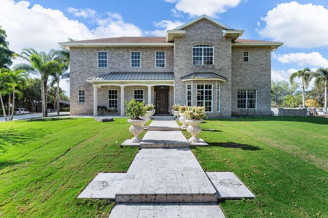 view of front of home with a front lawn