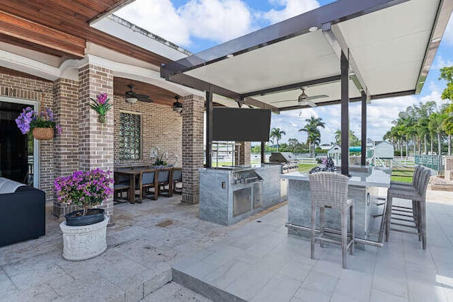 view of patio / terrace with area for grilling, grilling area, and ceiling fan