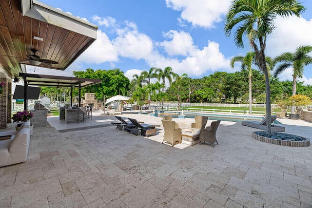 view of patio / terrace featuring ceiling fan