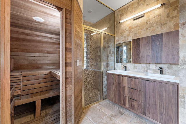 bathroom featuring vanity and a shower with shower door