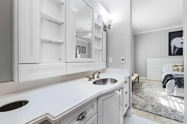 bathroom featuring vanity, tile patterned floors, and ornamental molding