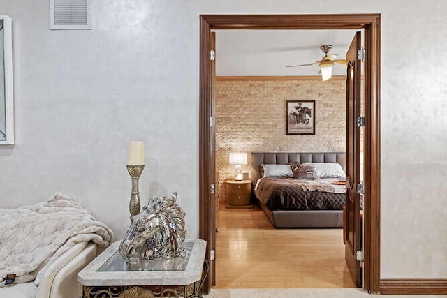 bedroom featuring light hardwood / wood-style flooring and ceiling fan