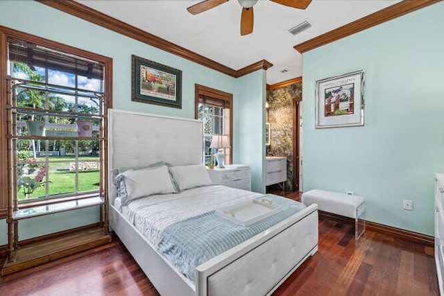 bedroom featuring dark wood-type flooring, ceiling fan, and ornamental molding