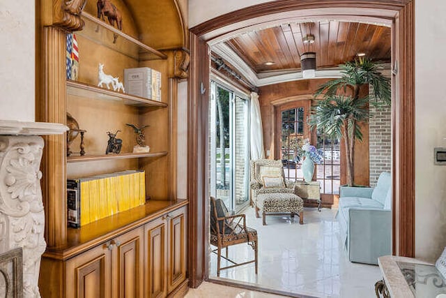 living area featuring ornamental molding and wooden ceiling